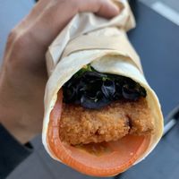 Plant based schnitzel wrap. Small an pricey but not bad    at SYD - Soul Origin - T2  in Mascot