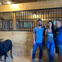 Sweet Farm co-founder Nate Salpeter (closest to the happy goat) at Sweet Farm in Himrod