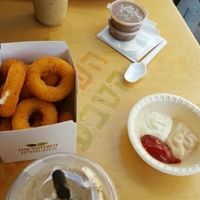 large onion rings and iced coffees at HaShwarma HaTivonit - The Vegan Shwarma in Tel Aviv