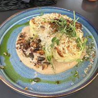 Cauliflower steak on cauliflower puree with roasted walnuts and seeds  at Wena Restaurant in Swinoujscie