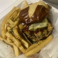 
Crispy Oyster mushrooms on a toasted pretzel bun with house made coleslaw, bbq sauce & fresh garlic pickles. Accompanied with seasoned fries  at Garden of Soul in Bedford