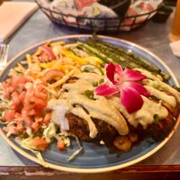 Sweet potato and poblano cakes topped with mushrooms and sunflower crema. Accompanied by grilled asparagus and mango and jicama slaw.  at Franklin Inn in Pittsburgh