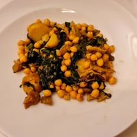 Chickpeas with wild mushrooms, spinach and roasted potatoes. 😋 at Restaurante Asador Casa Paca in Puebla De Sanabria