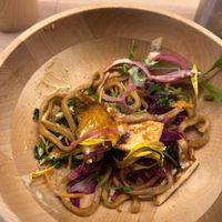 Half eaten, yummy fried noodles under all the vegies at Alohana Vegan Ramen in Osaka