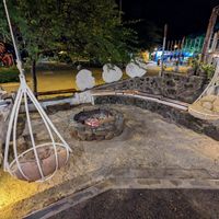 Chillout area next to a fire at Inti Garden in Puerto Baquerizo Moreno