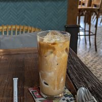 Iced Latte with Almond Milk at Roots  in Canggu