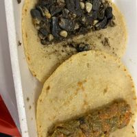 Tacos de huitlacoche and flor de calabaza on corn tortillas  at 3 Marias Quesadillas in Brownsville