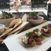 Indian potato cakes & Sweet potato peanut curry  at La Plaza in Malaga