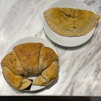 Tasty Vegan Ham and Cheese Croissant (left) and Potato and Spinach Empanada  at PURALMA Vegan Bakery in San Jose