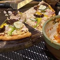 Food was so good that we forgot to take pictures until we were almost done. Vegan pizza and vegan pasta.   at Hope Cafe in Auroville