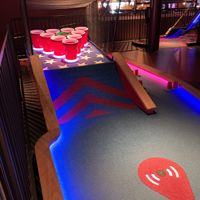 Creative obstacles at each hole  at Puttshack   in Oak Brook