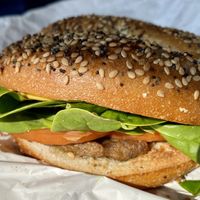 Vegan bagel sandwich- everything bagel, beyond sausage, tomato, spinach, vegan cheese    at GiraKofi in Stowe