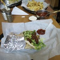 Sandwiches with fries and hot sauce at Falafels in Bloomington