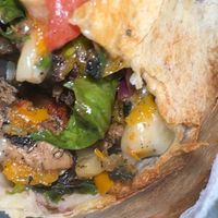 The gooey inside of the jerk wrap at 2 Phat Vegans in New Orleans