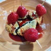Mochis coreanos de arroz, pasta dulce de frijol rojo y sésamo con sirope de frambuesa at NuMaru in Santiago De Compostela