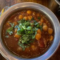 chana masala - Chickpeas in an onion tomato masala gravy. Served with steamed basmati  at Ghee Indian Kitchen in Kendall