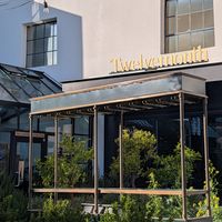 Patio seating and a green house! at Twelvemonth in Burlingame