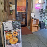 Entrance area and signage at Love For All in Kanazawa