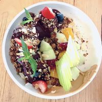 Fruit-loaded açaí bowl with granola and peanut butter. The prettiest I’ve ever seen!  at Cafe McKenzie in Randwick