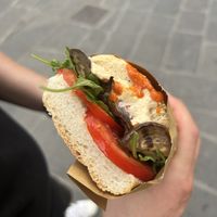HUMMUS sandwich (tomato, eggplant, chickpea hummus, arugula, oregano, bell pepper sauce, oil)  at L'Ostellino in Pisa