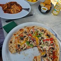 Vegan Polpette Pasta, vegan Verdure pizza, vegan dough balls, and chips. at The Lugger Inn in Penzance