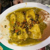 Zucchini enchiladas with a spicy tomatillo sauce. So good!  at Tarascos in Denver
