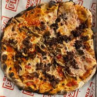 Build your own vegan pizza with Herbivorous Butcher cheese, plant based fennel sausage, oyster & shiitake mushrooms, and hot peppers 💚  at Surly Brewing Co in Minneapolis