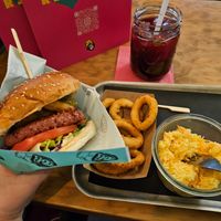 Power burger, onion rings, and coleslaw at Urban Gorillas - Vegan Revolution in Dusseldorf