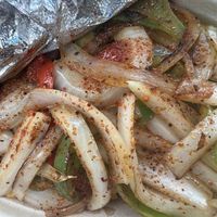 corn ribs under fajita veggies  at La Papa Hot Potato & Corn House in Peachtree City