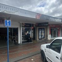 Storefront with covered outdoor seating to left    at Picton Pizza And Kebabs in Picton