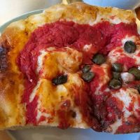 Pizza with home made mozzarella and capers at Pomodoro E Basilico  in West London