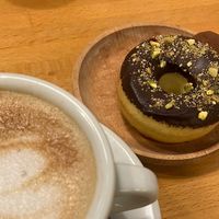 Café con avena, donut con pistacho, y trufa  at Gea The Healthy Bakery in Barcelona