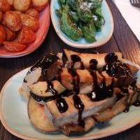 Fried aubergine with balsamic, potatoes bravas and fried peppers with salt flakes at Mondo in Stockholm