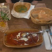 Daal soup, an appetizer with pumpkin, and their delicious “Hewad Water”  at Hewad Restaurant in Munich
