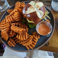Lentils Kindness burger with sweet potato waffle fries at The Ginger Mule in Houston