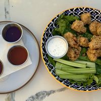 Cauliflower bites, we ordered all four sauces on the side so we could try them all! Buffalo was my favorite! The ranch is sooo good!  at The Ginger Mule in Houston
