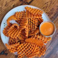 Waffle fries + delicious sauce at The Ginger Mule in Houston