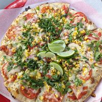 Pizza of the day with tomatoes, corn, vegan cheese at Sliver Pizzeria   in Lafayette