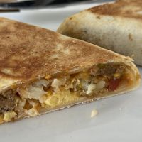 Breakfast burrito with just egg, hash brown, and vegan cheese and sausage.  at January Coffee in Boulder