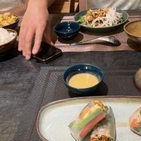 Spring rolls, black garlic noodles and a curry. All very delicious !   at Green Inn - Nhà hàng thuần chay in Hanoi