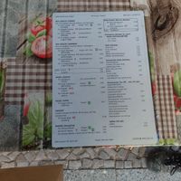 Menu. Vegan green flower is marked at Cafe Ogam in Berlin