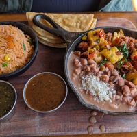 El asade skillet with side of salsa Verde at Penelope's Vegan Taqueria - Andersonville in Chicago