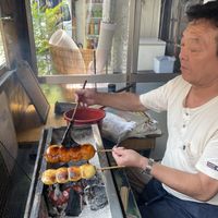 He asked me to photograph him doing this!  at Yaki Manju Shimamura in Gunma