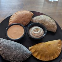 Patty calzones with two dips at Comewell's in North London