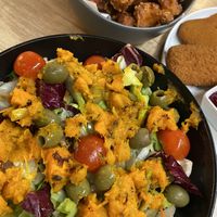 Hokkaido Salad and BBQ Cauliflower Wings in the background  at Das Delicious in Vienna