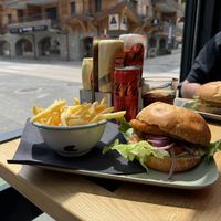 Hummus and guacamole burger served with French fries  at Au Bon Coin   in Morzine