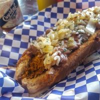 Andouille Sausage w/ Sauteed Onions, Red Beans & Rice, and Crystal Hot Sauce on a Grilled Multi-grain Bun at Dreamy Weenies in New Orleans