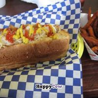 Vegan Chicken Dog with saurkraut and rosted garlic. Sweet potato fries at Dreamy Weenies in New Orleans