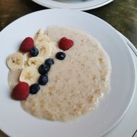 Bowl of porridge with almond milk and some fruit, paid 7,5 pounds for this which is a little expensive if you ask me. at Organic Deli Cafe in Oxford