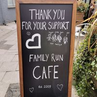 The drawing of the family is made by the daughter of the owner at Organic Deli Cafe in Oxford